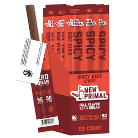 The New Primal grass-fed spicy beef sticks front-pack view, keto-friendly snack.