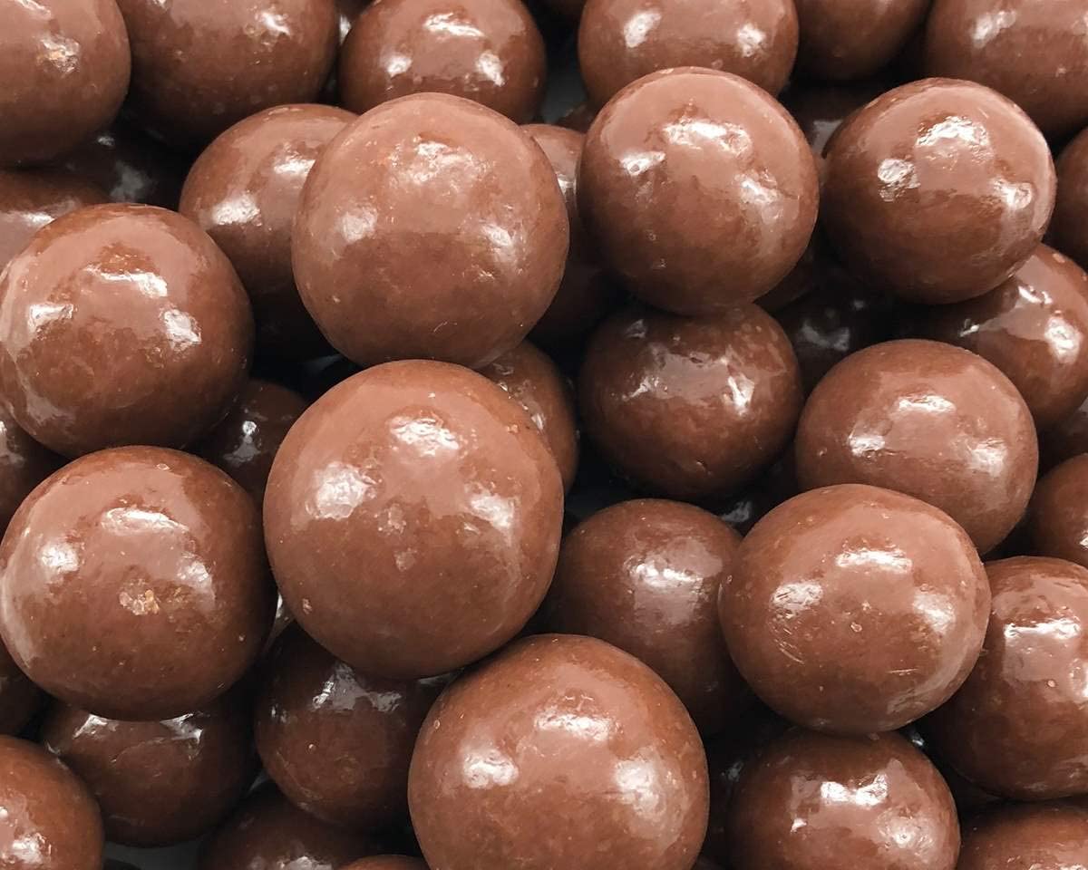 The Nutty Fruit House milk chocolate malt balls, individually wrapped for freshness.