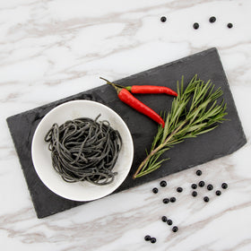 The Only Bean spaghetti served in a recipe-ready kitchen scene.