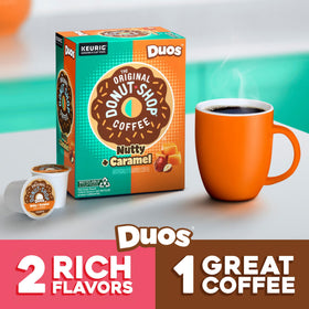 The Original Donut Shop Duos Nutty and Caramel coffee in a steaming cup, perfect for breakfast.