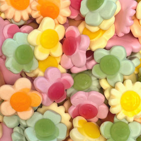 The Penny Candy Store Happy Flowers gummies in a 1-lb bag, colorfully shaped for sharing.