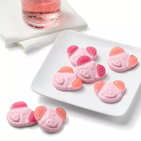 The Penny Candy Store Pink Gummi Pigs close-up texture, soft and chewy for celebrations