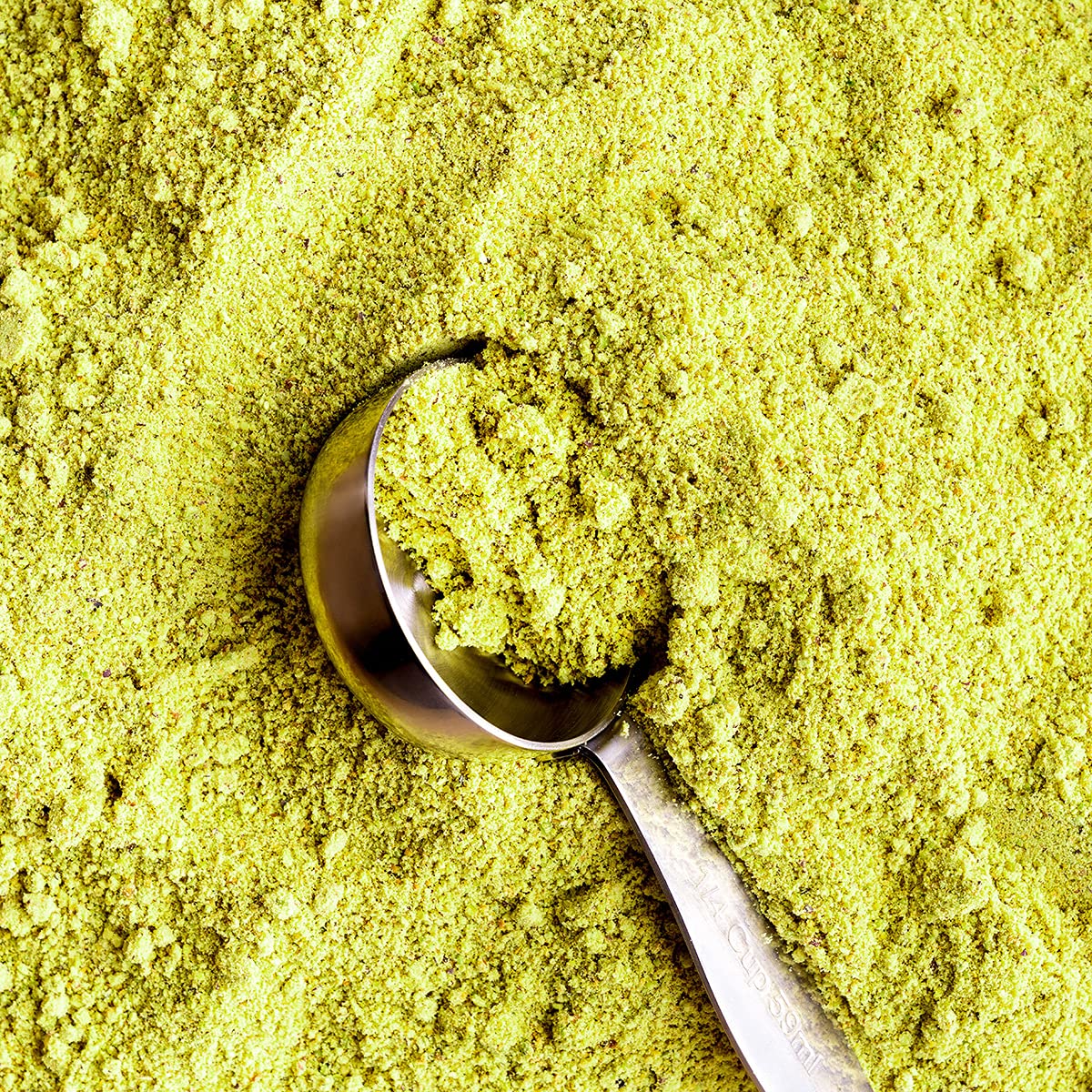 The Pistachio Factory pistachio flour being sifted over batter for versatile baking