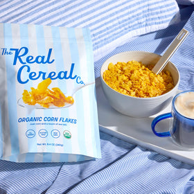 The Real Cereal Company oven-roasted corn flakes, crunchy bite without artificial flavors