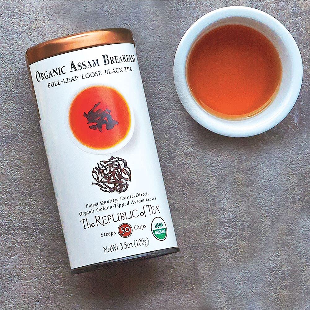 The Republic of Tea loose leaves in infuser, brewing robust breakfast flavor.