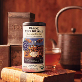 The Republic of Tea Assam Breakfast tea bags steeping in a cup for a bold, malty aroma.