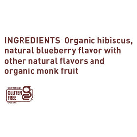 A glass of The Republic of Tea Blueberry Hibiscus Iced Tea served over ice.