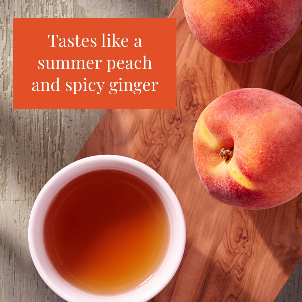 Brewing ginger peach tea in a glass cup to enjoy a fragrant, refreshing sip.
