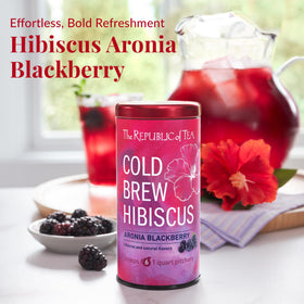 The Republic of Tea hibiscus close-up with rosehips and aronia berries showing natural ingredients.