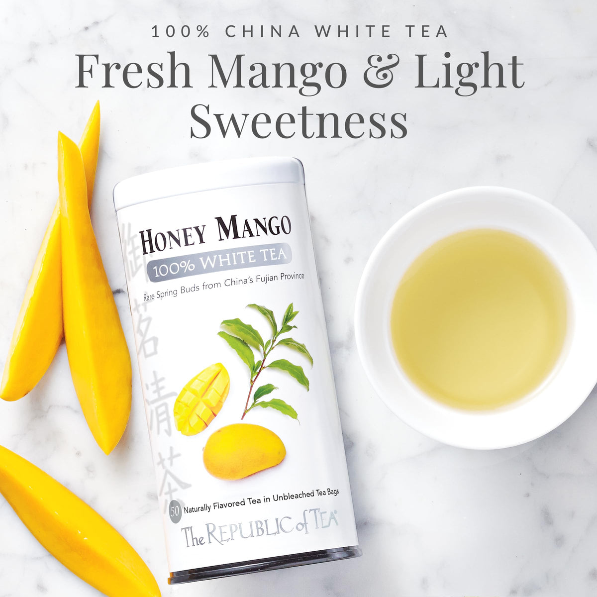 Cup with steeped Honey Mango White Tea highlighting bright aroma.