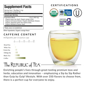 The Republic of Tea cup with a lemon slice beside SuperGreen infusion