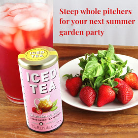 Fresh ingredients of The Republic of Tea Strawberry Basil Green Tea blend.