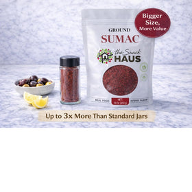 The Snack Haus sumac jar beside grilled vegetables dish.
