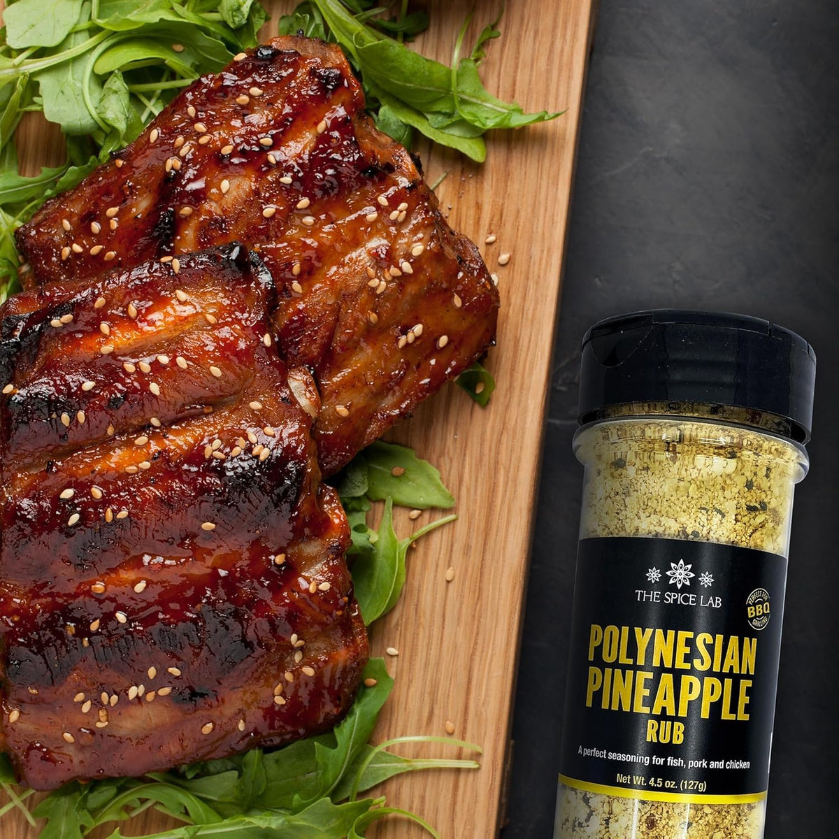 The Spice Lab Brown Sugar Chili Rub bottle delivers bold sweet heat on ribs.