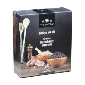 Pink Himalayan salt in use on grilled meat for enhanced flavor.