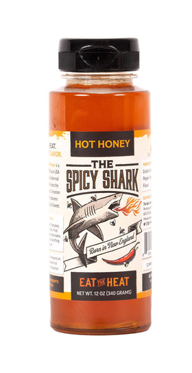 The Spicy Shark Hot Honey 12oz bottle showing premium USA honey for versatile flavor.