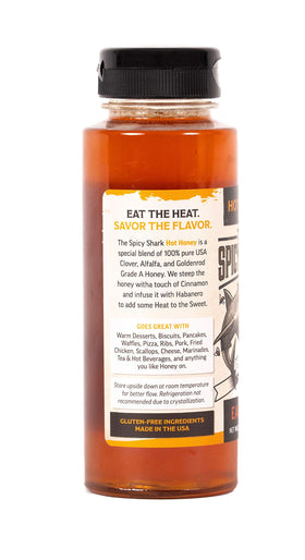 Pouring The Spicy Shark Hot Honey to illustrate drizzle-ready texture for pizzas and desserts.
