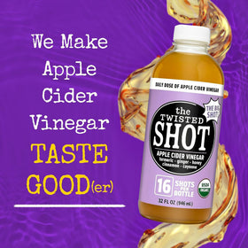 The Twisted Shot ingredients close-up shows organic ginger, turmeric, honey, and cinnamon.