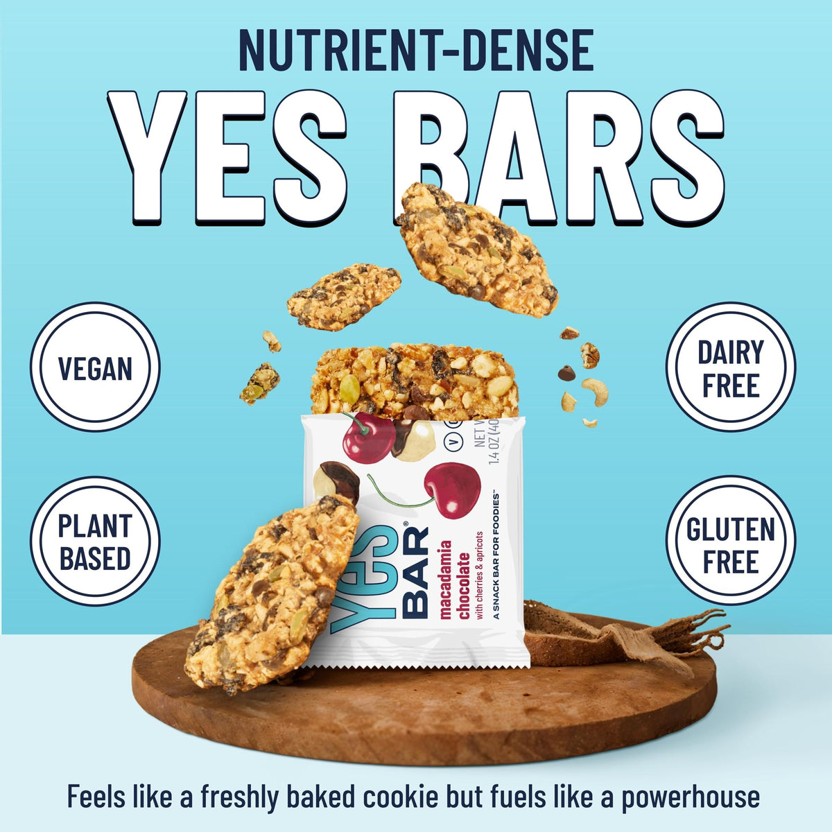 The YES Bar macadamia chocolate close-up showing nuts and seeds.