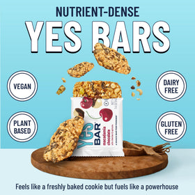 The YES Bar macadamia chocolate close-up showing nuts and seeds.