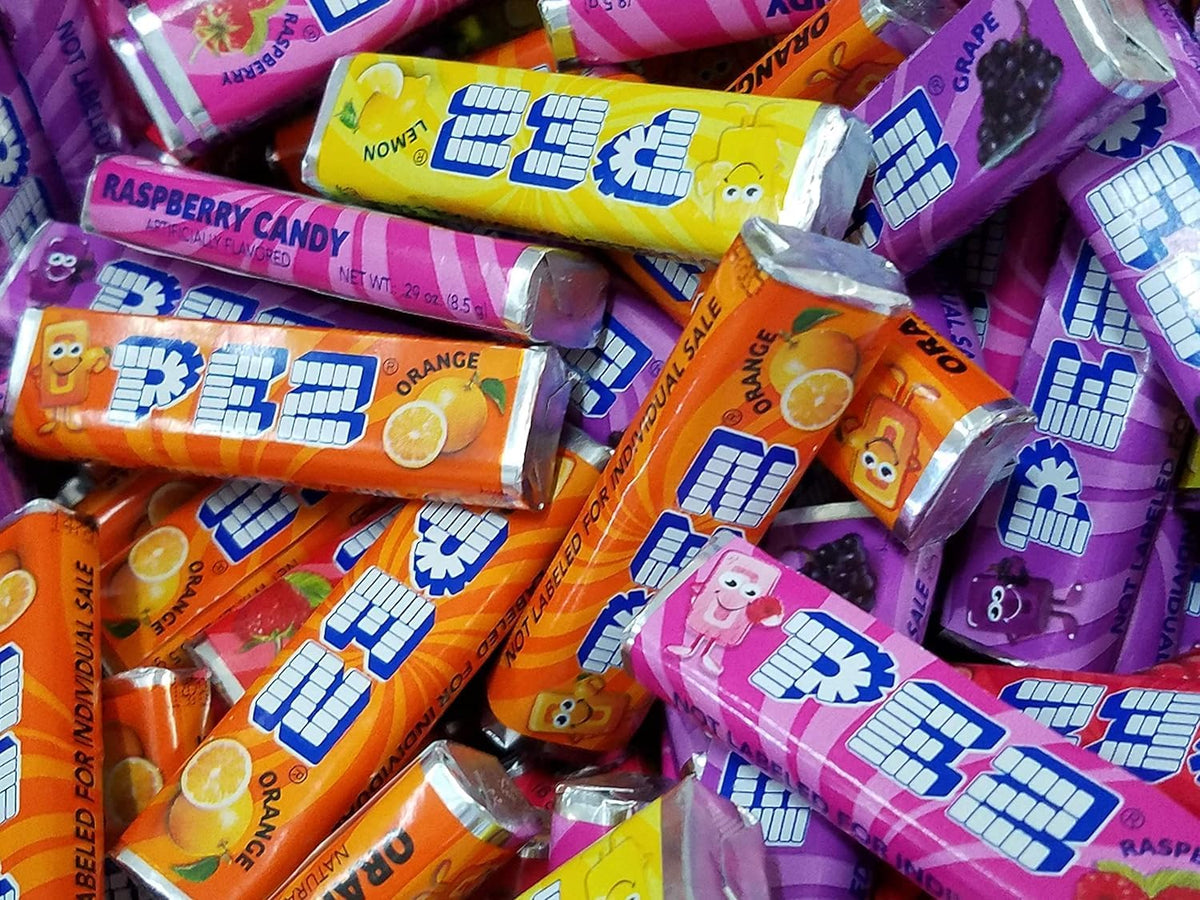 TheCandyCo PEZ refill rolls showcase six classic flavors for versatile snacking.