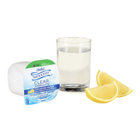 Glass of Thick & Easy Hydrolyte Lemon Water with electrolytes for hydration.