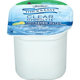 Thick & Easy Hydrolyte Lemon Water being poured, a lemon-flavored thickened drink.