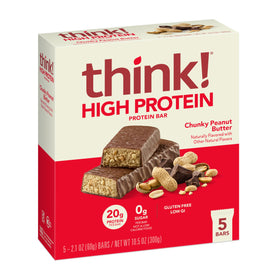Think Bar chunky peanut butter bar texture close-up showing peanuts and chocolate.