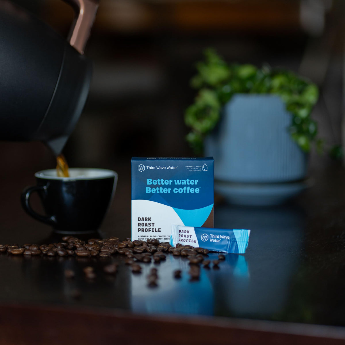 Pouring Third Wave Water into a coffee maker for consistent brew