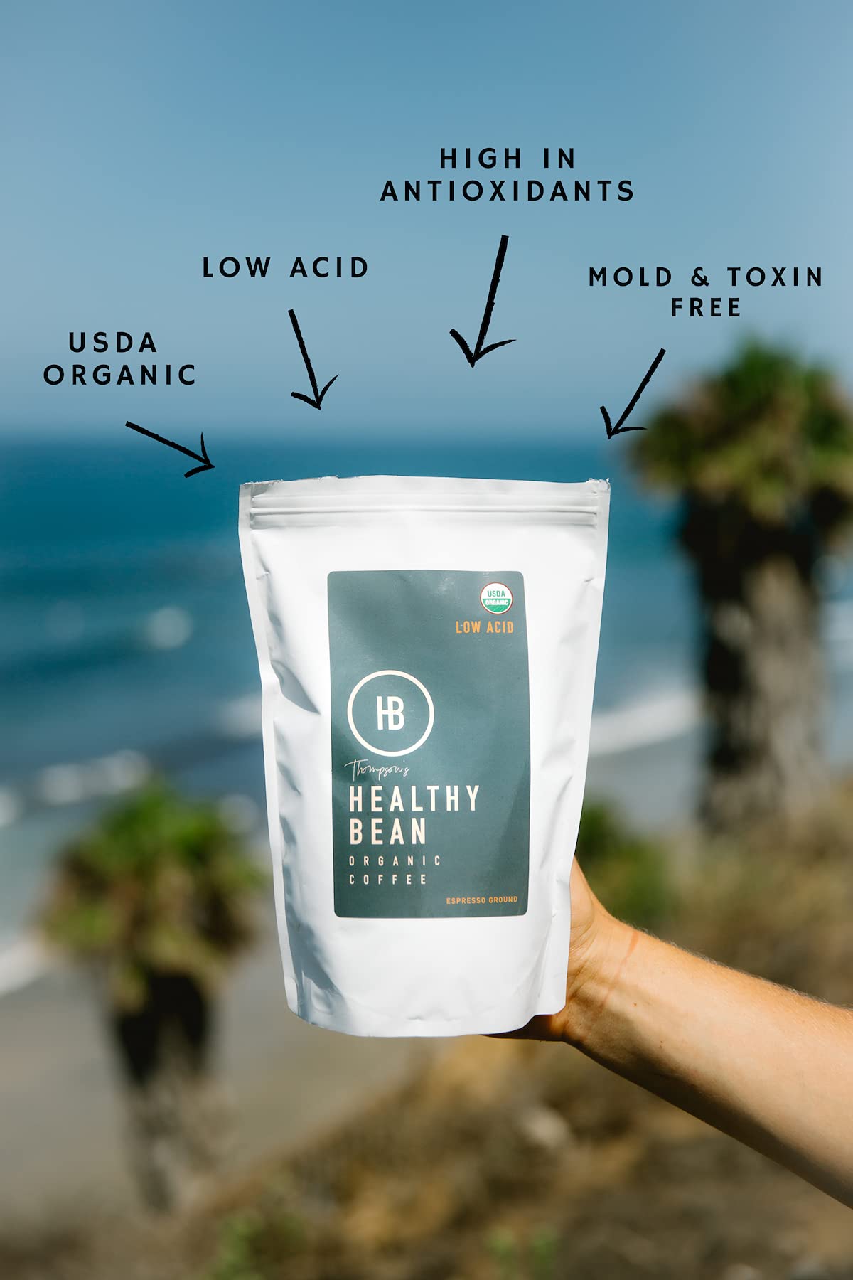 Steaming cup shows Thompson's Healthy Bean espresso with smooth finish and full-bodied profile.