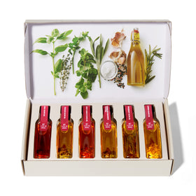 Thoughtfully Gourmet Tuscan olive oil bottle pairs with vegetables and pasta.