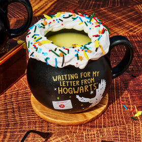 Thoughtfully Harry Potter whipped-cream topping completes a magical cocoa moment