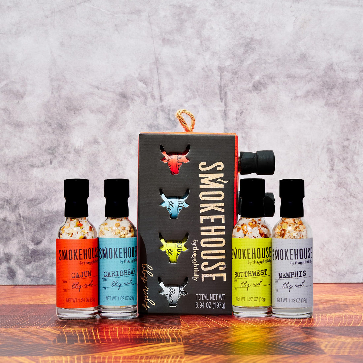 Thoughtfully Smokehouse set packaging shows four glass bottles in a gift-ready box