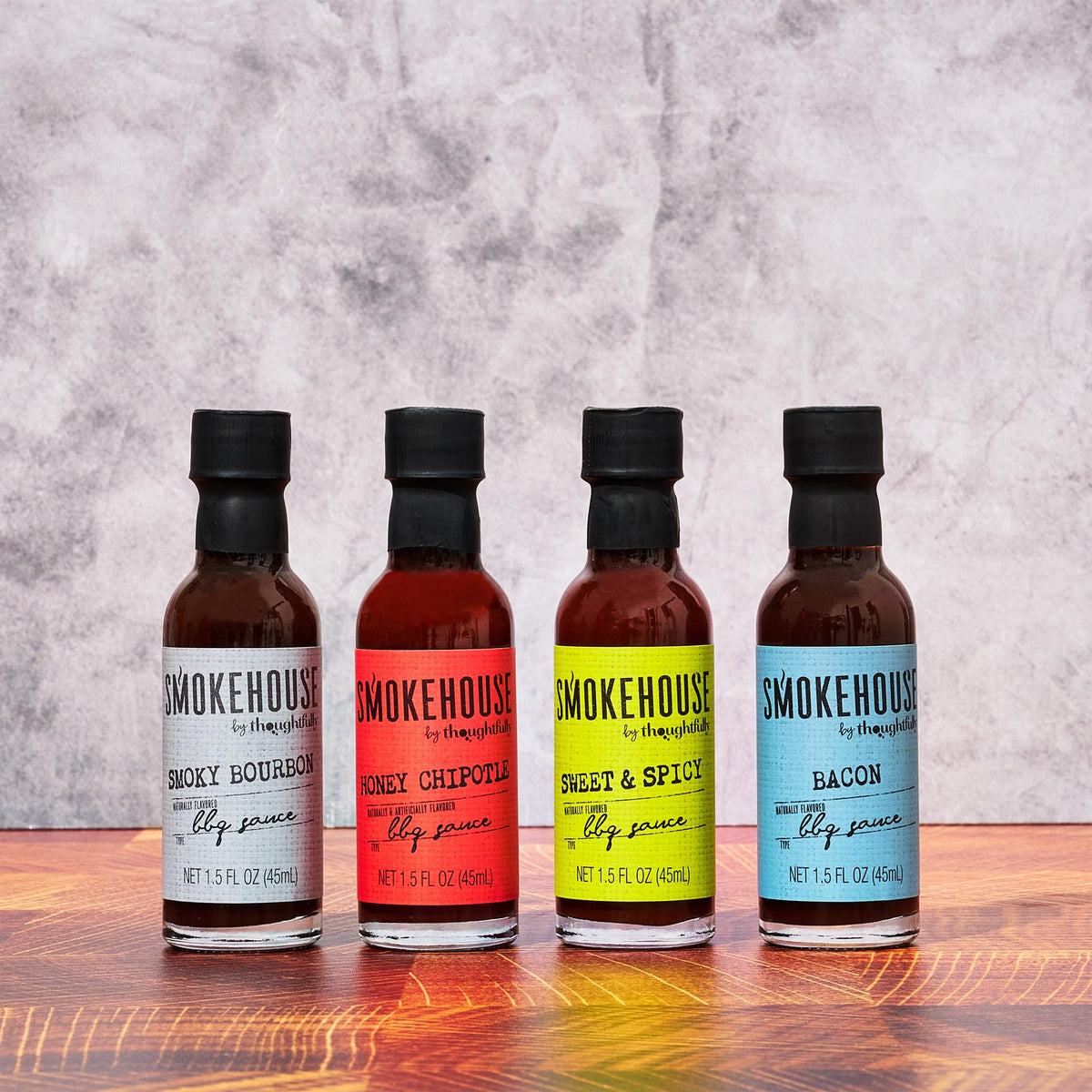 Thoughtfully Smokehouse Smoky Bourbon pour adding depth to burgers and veggies.
