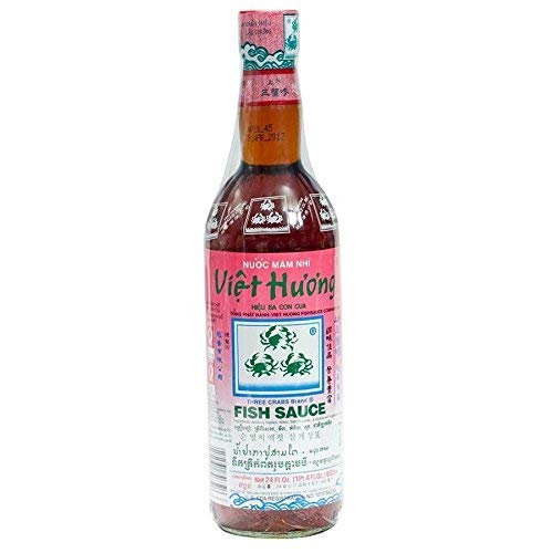 Three Crabs Brand Fish Sauce bottle for rich umami in cooking.