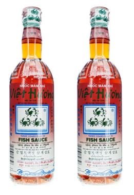 Three Crabs Fish Sauce bottle close-up, rich umami for dipping and cooking.