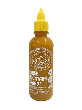 Three Mountains Yellow Sriracha bottle pour demonstrates quick flavor boost