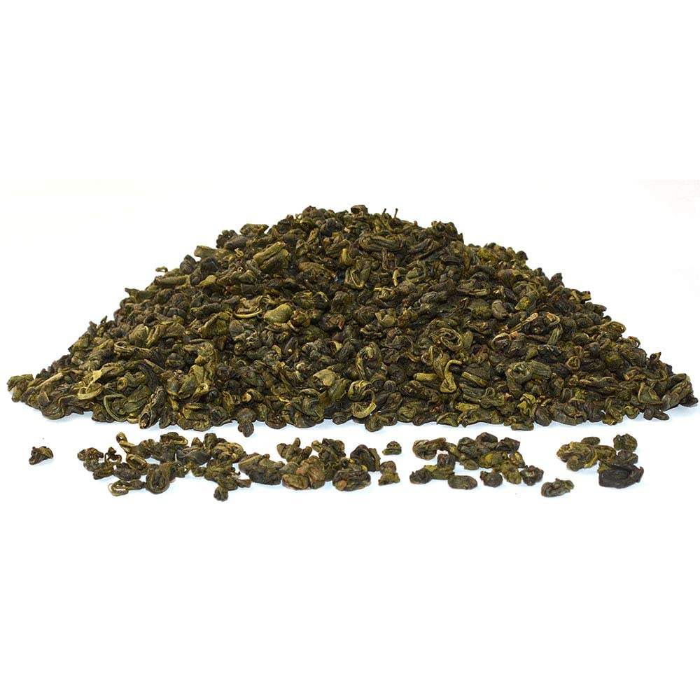 Tian Hu Shan brewed cup shows light, bright liquor and subtle sweetness