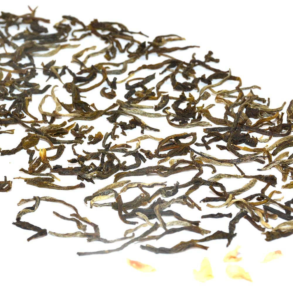Jasmine flowers infusing Tian Hu Shan tea for a layered fragrance