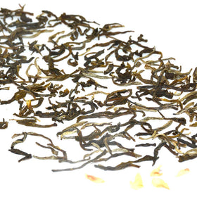Jasmine flowers infusing Tian Hu Shan tea for a layered fragrance