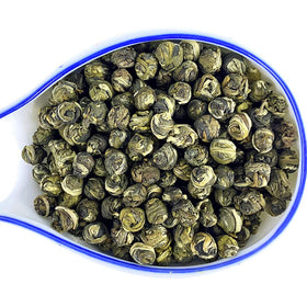 Tian Hu Shan Jasmine Dragon Pearls brewed liquor with bright jade infusion.