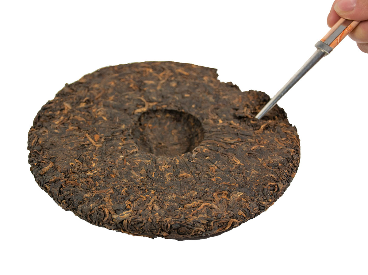 Tian Hu Shan tea cake in close-up after brewing shows aroma lasting through several steeps.