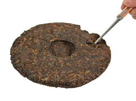 Tian Hu Shan tea cake in close-up after brewing shows aroma lasting through several steeps.