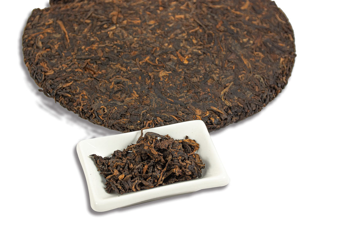 Tian Hu Shan Puerh tea cake cutting angle showcases uniform compression.