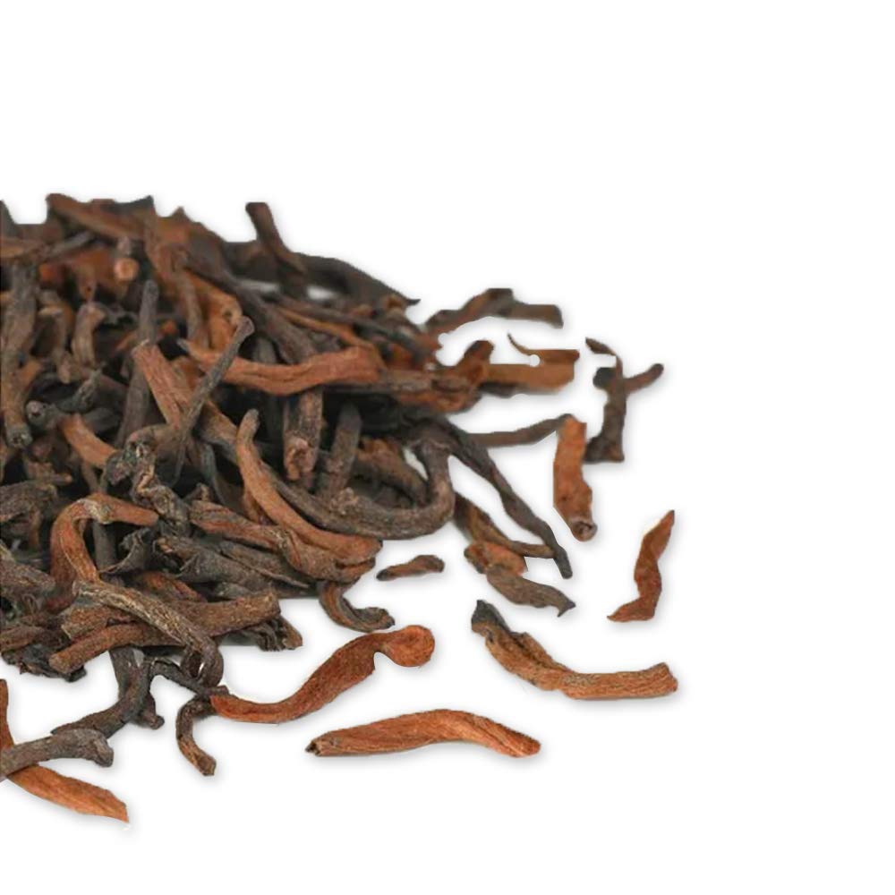 Tian Hu Shan Puerh cup-shot showcases warm, inviting pour for quiet moments.