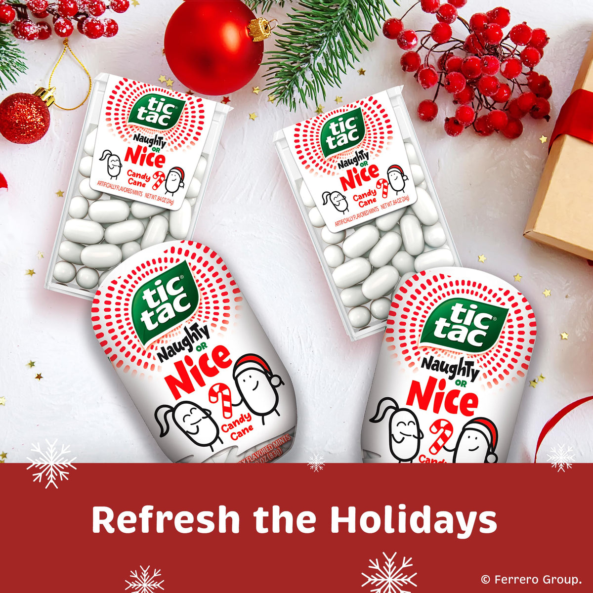 Tic Tac Naughty or Nice Candy Cane mints pack side view, ready for gifting.