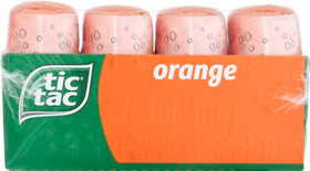 Tic Tac Orange mints pouring from a bottle for quick refresh