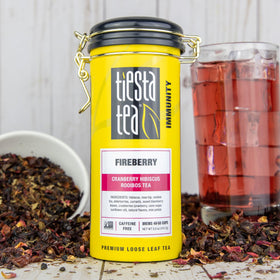Tiesta Tea Cranberry Hibiscus Rooibos in glass mug, bright berry aroma