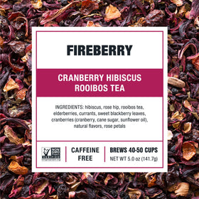Tiesta Tea Fireberry loose leaf atop a wooden table