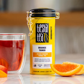 Tiesta Tea Orange Tango loose leaf scoop showing fresh, fruity aroma potential.